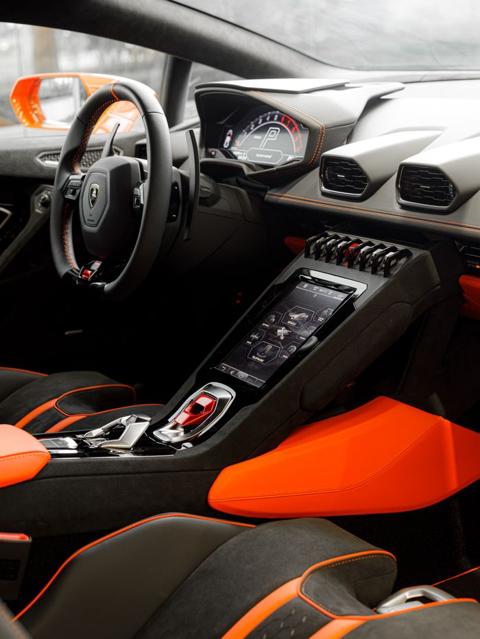 services-01 High-end sports car dashboard with advanced digital controls in a sleek, modern design.